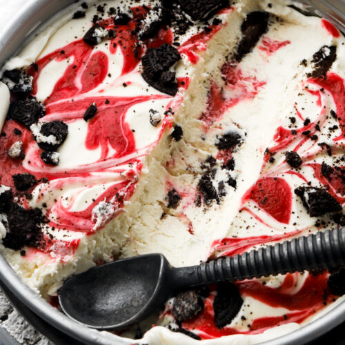 white chocolate raspberry ice cream with a scoop removed