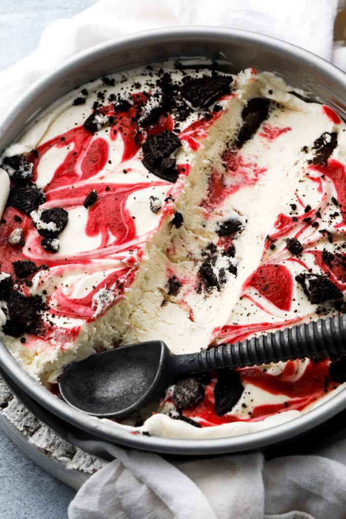white chocolate raspberry ice cream with a scoop removed