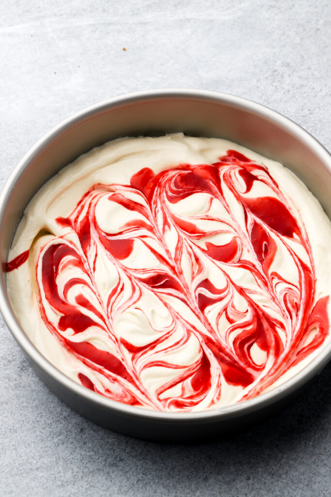raspberry sauce swirled into ice cream